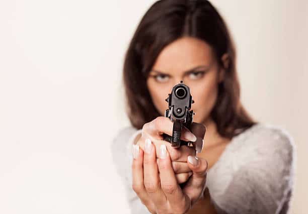 woman holding a gun