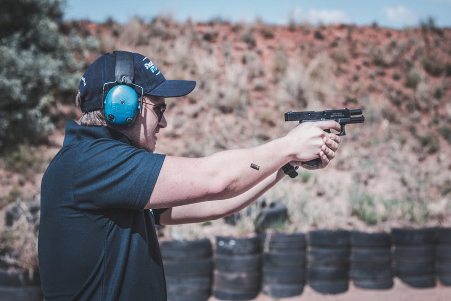 Guy having a practice shooting in his gun