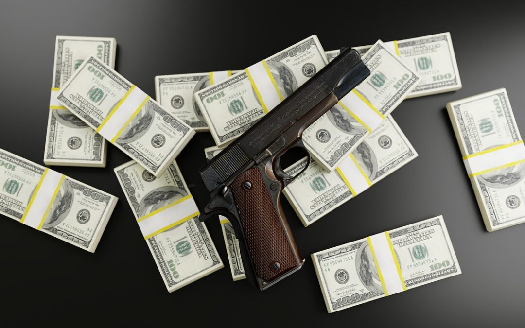 Gun on top of bundle of money